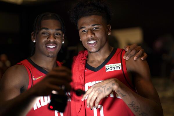 Houston Rockets' Jalen Green, right, and Josh Christopher film themselves during an NBA basketball media day Monday, Sept. 27, 2021, in Houston. (AP Photo/David J. Phillip)