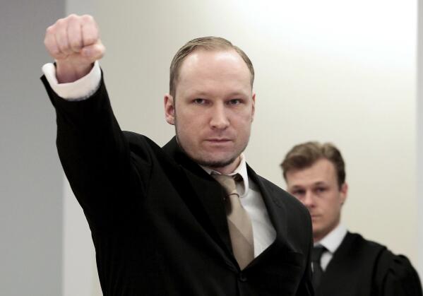 FILE - In this Tuesday, April 17, 2012 file photo, accused Norwegian Anders Behring Breivik gestures as he arrives at the courtroom, in Oslo, Norway. On the ten-year anniversary of Norway’s worst peacetime slaughter, survivors of Anders Breivik’s 22 July assault worry that the seam of racism that nurtured the anti-Islamic mass-murderer is re-emerging. Most of Breivik’s 77 victims were teen members of the Labor Party Youth wing - idealists enjoying their annual camping trip on the tranquil, wooded island of Utoya. Today many survivors are battling to keep their vision for their country alive. (Hakon Mosvold Larsen/NTB Scanpix, via AP, File)