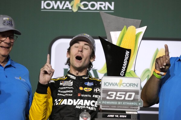 Ryan Blaney celebrates in victory lane after winning a NASCAR Cup Series auto race, Sunday, June 16, 2024, at Iowa Speedway in Newton, Iowa. (AP Photo/Charlie Neibergall)