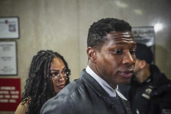 Actor Jonathan Majors arrives at court for his domestic assault trial, Tuesday, Dec. 5, 2023, in New York. Majors was charged last spring for allegedly assaulting his then-girlfriend during an argument. (AP Photo/Bebeto Matthews)