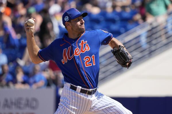 New York Mets starting pitcher Max Scherzer tosses the ball up