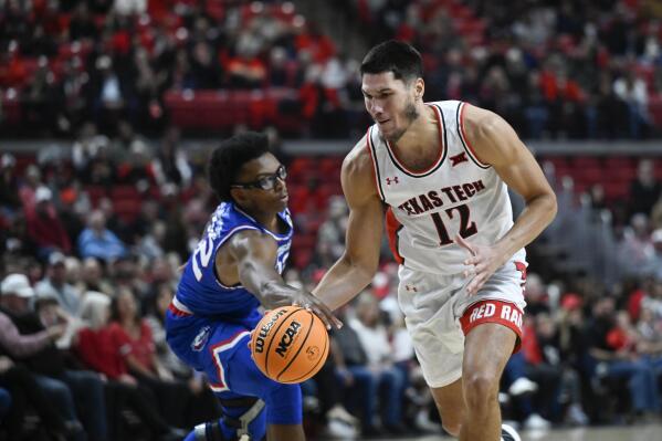 Louisiana Tech forward Isaiah Crawford pushes the ball away from Texas Tech forward Daniel Batcho (12) during the first half of an NCAA college basketball game, Monday, Nov. 14, 2022, in Lubbock, Texas. (AP Photo/Justin Rex)