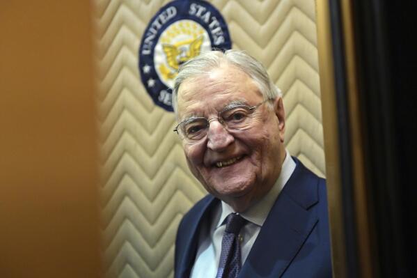 FILE - Former Vice President Walter Mondale smiles as he gets on an elevator on Capitol Hill in Washington, Jan. 3, 2018. Biden plans to speak at a memorial service in Minnesota on Sunday, May 1, for Mondale, who died last April at age 93. (AP Photo/Susan Walsh, File)