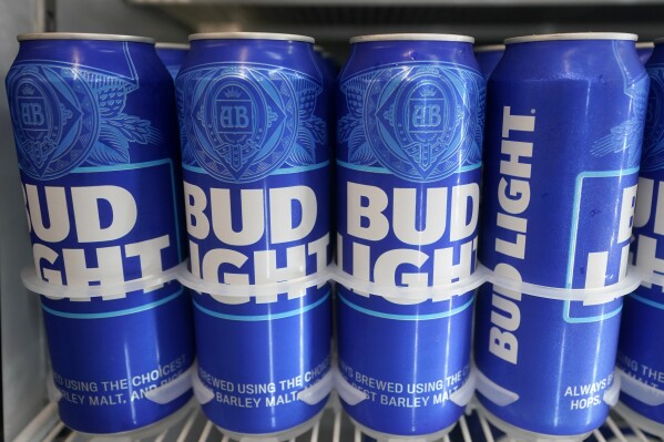 Cans of Bud Light chill in a refrigerator in Oakland, Calif., Friday, April 28, 2023. After more than two decades as America's best-selling beer, Bud Light has slipped into second place. Modelo Especial, a Mexican lager, overtook Bud Light in U.S. retail dollar sales in the month ending June 3. (AP Photo/Jeff Chiu)