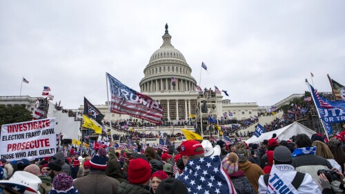FILE - Rioters loyal to President Donald Trump rally at the U.S. Capitol in Washington on Jan. 6, 2021. Law enforcement officials say, Taylor Taranto, a man wanted for crimes related to the Jan. 6, 2021, insurrection at the U.S. Capitol has been arrested in the Washington neighborhood where former President Barack Obama lives. Taranto was seen a few blocks from the former president's home, and he fled even though he was chased by U.S. Secret Service agents. (AP Photo/Jose Luis Magana, File)