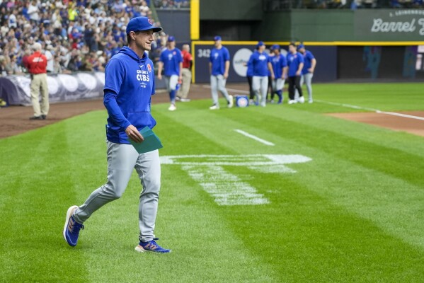 Chicago Cubs manager Craig Counsell walks out to exchange lineups before a baseball game against the Milwaukee Brewers Monday, May 27, 2024, in Milwaukee. (AP Photo/Morry Gash)