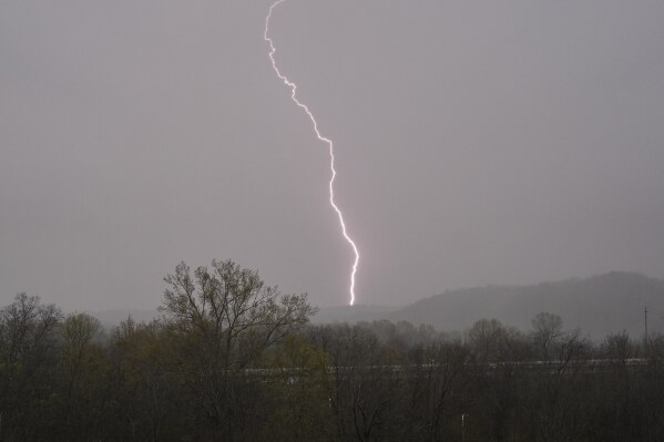 Lightning strikes as storms move through the area Wednesday, April 2, 2025, in Ashland City, Tenn. (AP Photo/George Walker IV)