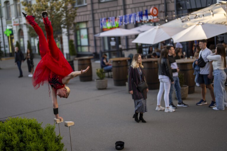 A street artist performs in downtown Kyiv, Ukraine, Sunday, April 28, 2024. (AP Photo/Francisco Seco)