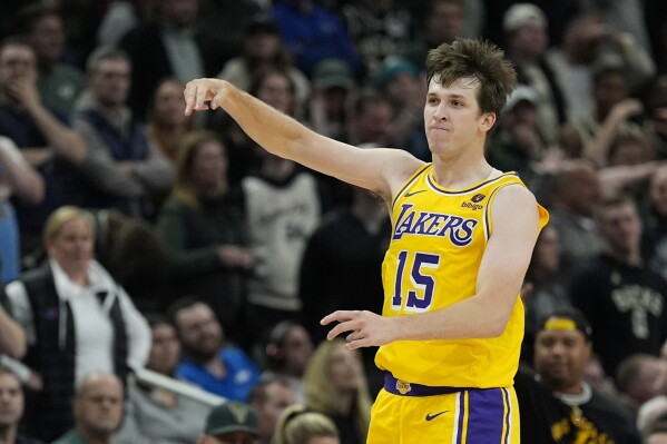Los Angeles Lakers' Austin Reaves reacts after making a three pointer during the second overtime of an NBA basketball game against the Milwaukee Bucks Tuesday, March 26, 2024, in Milwaukee. The Lakers won 128-124 in double overtime. (AP Photo/Morry Gash)