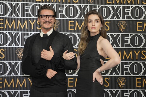 Pedro Pascal, left, and Lux Pascal arrive at the 75th Primetime Emmy Awards on Monday, Jan. 15, 2024, at the Peacock Theater in Los Angeles. (AP Photo/Ashley Landis)