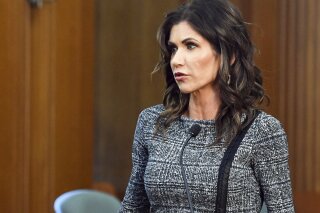 FILE- In this Oct. 13, 2020, file photo, South Dakota Gov. Kristi Noem speaks in Sioux Falls, S.D. Gov. Noem's effort to limit the powers of conservation officers suffered a partial setback in the Legislature on Tuesday, March 2, 2021, with debate in one Senate committee resulting in a lively exchange between her staff and Republican senators. (Erin Bormett/The Argus Leader via AP, File)