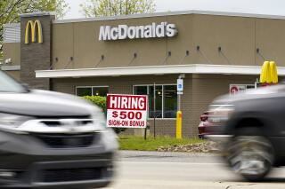 A hiring sign offers a $500 bonus outside a McDonalds restaurant, in Cranberry Township, Butler County, Pa., Wednesday, May 5, 2021.  U.S. employers posted a record number of available jobs in March, starkly illustrating the desperation of businesses to hire more people as the economy expands. Yet total job gains increased only modestly that month, according to a Labor Department report issued Tuesday, May 11. (AP Photo/Keith Srakocic)