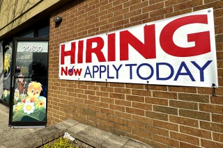 A hiring sign is displayed in Riverwoods, Ill., Tuesday, April 16, 2024. On Thursday, April 18, 2024, the Labor Department reports on the number of people who applied for unemployment benefits last week. (AP Photo/Nam Y. Huh)