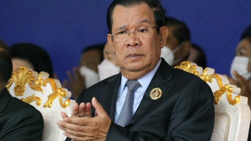 FILE - Cambodian Prime Minister Hun Sen claps during the 71st anniversary celebration of the Cambodian People's Party (CPP) at its headquarters in Phnom Penh, Cambodia, Tuesday, June 28, 2022. A quasi-independent review board has recommended that Facebook suspend that Cambodian Prime Minister Hun Sen’s Facebook and Instagram accounts for six months for using language that could incite violence. (AP Photo/Heng Sinith, File)