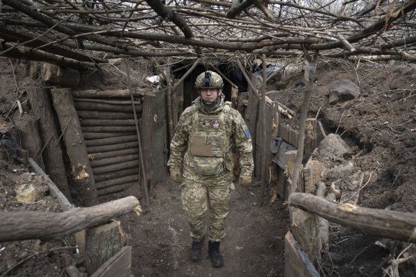 A Ukrainian serviceman of the 28th Separate Mechanised Brigade stands in a trench at the front line, near Bakhmut, Donetsk region, Ukraine, March 3, 2024. (AP Photo/Efrem Lukatsky, File)