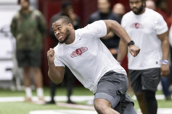 FILE - Evan Neal participates in position drills at Alabama's NFL Pro Day, Wednesday, March 30, 2022, in Tuscaloosa, Ala. The Jaguars have the No. 1 pick in the NFL Draft for the second consecutive year. Alabama left tackle Evan Neal or North Carolina State’s Ikem “Ickey” Ekwonu seemingly make as much sense for Jacksonville as Michigan standout pass rusher and betting favorite Aidan Hutchinson.(AP Photo/Vasha Hunt, File)
