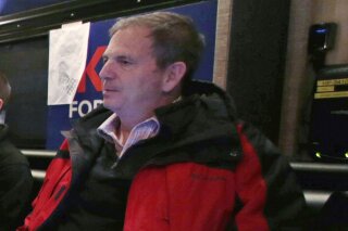 In this Jan. 20, 2016 file photo, John Weaver is shown on a campaign bus in Bow, N.H.  The Lincoln Project was launched in November 2019 as a super PAC that allowed its leaders to raise and spend unlimited sums of money. In June 2020, members of the organization’s leadership were informed in writing and in subsequent phone calls of at least 10 specific allegations of harassment against co-founder John Weaver, including two involving Lincoln Project employees, according to multiple people with direct knowledge of the situation. (AP Photo/Charles Krupa)