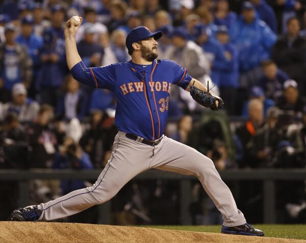 FILE - New York Mets pitcher Matt Harvey throws during the first inning of Game 1 of the Major League Baseball World Series against the Kansas City Royals, Tuesday, Oct. 27, 2015, in Kansas City, Mo. Matt Harvey announced Frida, May 5, 2023, he's retiring from baseball after a nine-year pitching career highlighted by his time as the Mets' “Dark Knight” ace. (AP Photo/Matt Slocum, File)