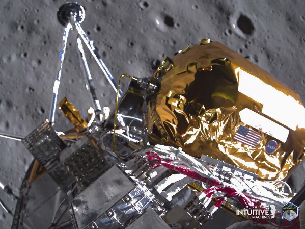 This image provided by Intuitive Machines on Tuesday, Feb. 27, 2024 shows its Odysseus lunar lander over the south pole region of the Moon. The toppled lunar lander is still beaming back pictures of the moon, as its nears the final hours of its life. The photos were taken shortly before last Thursday's touchdown. (Intuitive Machines via AP)