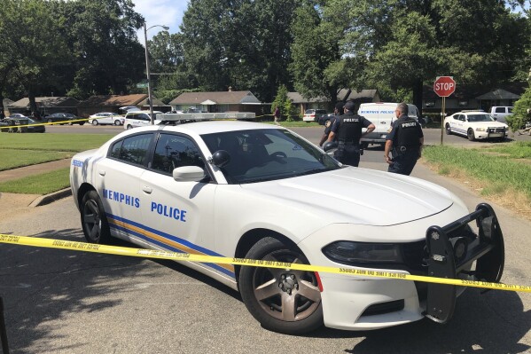 FILE - Memphis police officers work the scene of an officer-involved shooting, Monday, July 31, 2023, in Memphis, Tenn. Authorities said Friday, Aug. 4, a Tennessee man who attempted to enter a Jewish school with a gun fired shots at a construction worker there and later pointed his weapon at an officer before police wounded him on a residential street. Police say 33-year-old Joel Bowman went to Margolin Hebrew Academy-Feinstone Yeshiva of the South school in Memphis on Monday and tried to get inside, but he was denied entry. (AP Photo/Adrian Sainz, File)