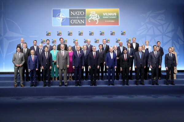 NATO heads of state and government pose during a group photo at a NATO summit in Vilnius, Lithuania, Tuesday, July 11, 2023. NATO's summit began Tuesday with fresh momentum after Turkey withdrew its objections to Sweden joining the alliance, a step toward the unity that Western leaders have been eager to demonstrate in the face of Russia's invasion of Ukraine. (AP Photo/Pavel Golovkin)