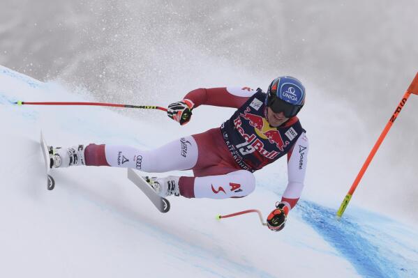 Austria's Matthias Mayer speeds down the course during an alpine ski, men's World Cup downhill, in Kitzbuehel, Austria, Sunday, Jan. 23, 2022. (AP Photo/Marco Trovati)