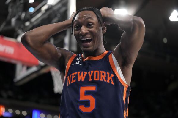 New York Knicks guard Immanuel Quickley (5) reacts after drawing a foul during the second half of an NBA basketball game against the Boston Celtics, Monday, Feb. 27, 2023, in New York. (AP Photo/John Minchillo)