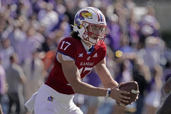 Kansas quarterback Jason Bean looks to pass during the second half of an NCAA college football game against TCU Saturday, Oct. 8, 2022, in Lawrence, Kan. TCU won 38-31. (AP Photo/Charlie Riedel)