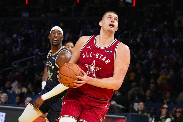 Denver Nuggets center Nikola Jokic (15) goes up for a shot during the first half of an NBA All-Star basketball game in Indianapolis, Sunday, Feb. 18, 2024. (AP Photo/Darron Cummings)