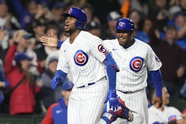 Canario's grand slam helps Cubs rout Pirates 14-1 to open half-game lead  for last wild card | AP News