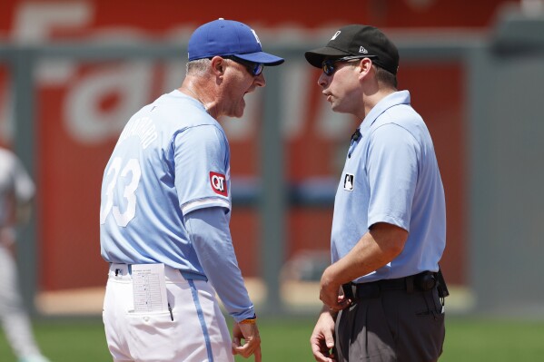 Kansas City Royals manager Matt Quatraro (33) argues a call by second base umpire Paul Clemons, right, during the sixth inning of a baseball game against the New York Yankees in Kansas City, Mo., Thursday, June 13, 2024. Quatraro was ejected from the game. (AP Photo/Colin E. Braley)