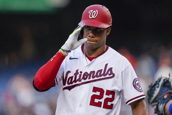 Washington Nationals manager Dave Martinez walks back to the dugout after a  pitching change during a baseball game against the Atlanta Braves early  Saturday, Aug. 14, 2021, in Washington. (AP Photo/Nick Wass