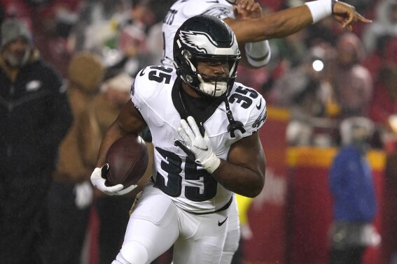 FILE -Philadelphia Eagles running back Boston Scott warms up during a NFL game Monday, Nov. 21, 2023 in Kansas City, Mo. Veteran running back Boston Scott agreed to a one-year deal with the Los Angeles Rams on Wednesday, MAy 1, 2024. (AP Photo/Ed Zurga, File)