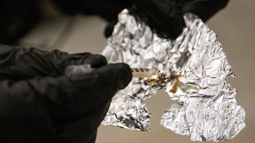 FILE - A BART police officer displays the Fentanyl he confiscated while patrolling the Civic Center Station BART platform in San Francisco, Nov. 20, 2020. An Oregon county's controversial policy that would have distributed tin foil and straws for fentanyl users and glass pipes for methamphetamine and crack users through the health department has been halted. "Our health department went forward with this proposal without proper implementation protocols," Multnomah County Chair Jessica Vega Pederson said in a statement to KGW-TV. (Jessica Christian/San Francisco Chronicle via AP, File)