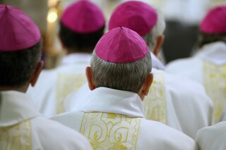 FILE - All of the bishops of France attend a mass in Notre-Dame Cathedral in Lourdes, southwestern France, on Nov. 9, 2019. A French bishop has been given a preliminary charge of attempting to rape an adult man a decade ago, the Paris prosecutor’s office said Monday Nov. 20, 2023. It is the latest of a growing number of accusations of sexual abuse by clergy in France. (AP Photo/Bob Edme, File)