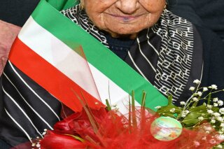 This photo taken on March, 19, 2018 shows Giuseppina Robucci from Poggio Imperiale, near Foggia, Southern Italy. A 116-year-old Italian woman who was the oldest person in Europe and the second-oldest in the world has died. The news agency ANSA said Giuseppina Robucci died Tuesday in the southern Italian town of Poggio Imperiale, where she was born on March 20, 1903. She lived 116 years and 90 days. Robert Young of the U.S.-based Gerentology Research Group said Robucci was the last European born in 1903. She was just two months younger than the current oldest living person, Kane Tanaka of Japan, born on Jan. 2, 1903. Robbuci is currently No. 17 on the list of people who lived the longest lives. (Franco Cautillo/ANSA via AP)