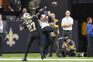 New Orleans Saints cornerback Alontae Taylor breaks up a pass intended for Baltimore Ravens wide receiver DeSean Jackson in the first half of an NFL football game in New Orleans, Monday, Nov. 7, 2022. (AP Photo/Gerald Herbert)