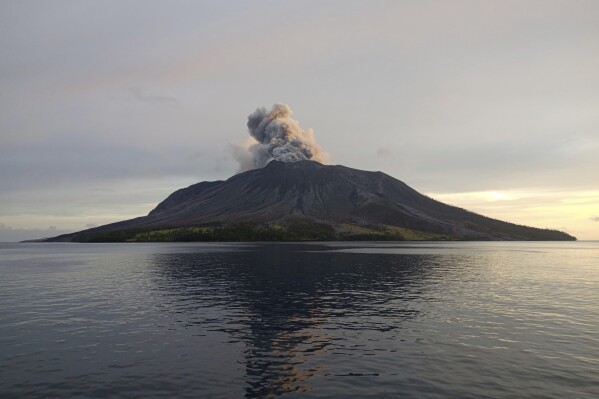 This photo provided by the Indonesian National Search and Rescue Agency (BASARNAS) shows a view of an eruption of Mount Ruang in the Sulawesi island, Indonesia, Friday, April 19, 2024. More people living near the erupting volcano on Indonesia's Sulawesi Island were evacuated on Friday due to the dangers of spreading ash, falling rocks, hot volcanic clouds and the possibility of a tsunami. (National Search and Rescue Agency via AP)
