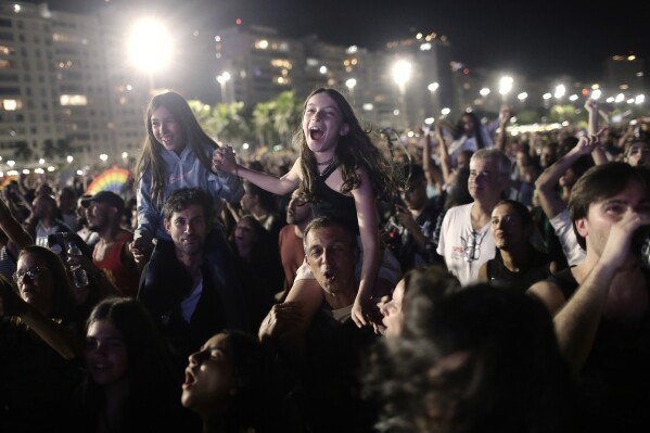 Fans cheer as they watch Lady Gaga free concert on Copacabana beach, in Rio de Janeiro, Sunday, May 4, 2025. (AP Photo/Bruna Prado)