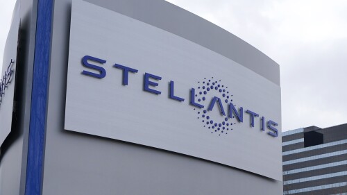 FILE - A Stellantis sign is seen outside the Chrysler Technology Center, Jan. 19, 2021, in Auburn Hills, Mich. Stellantis says that when it starts to sell compact and midsize electric vehicles off new underpinnings next year, they will be able to go up to 435 miles (700 kilometers) per charge. The company made the claim Wednesday, July 5, 2023, as it unveiled its new medium-sized platform designed for the purpose of housing battery packs and electric drive trains. (AP Photo/Carlos Osorio, File)