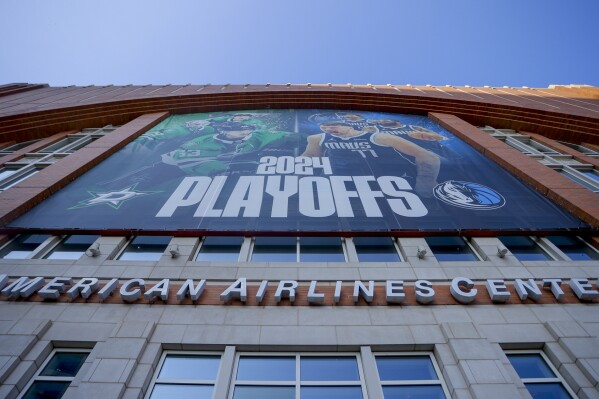 The exterior of American Airlines Center is seen prior to Game 4 of the NBA basketball Western Conference finals between the Dallas Mavericks and the Minnesota Timberwolves, Tuesday, May 28, 2024, in Dallas. The Timberwolves won 105-100. The arena is on the verge of hosting the NHL and NBA finals as the Dallas Stars and Mavericks are currently playing in the Western Conference finals in their respective leagues. (AP Photo/Gareth Patterson)