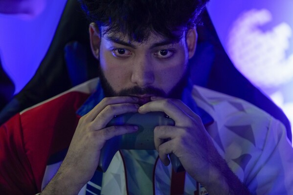Paraguay's Alejandro Barrientos competes in the Esports championship at the Pan American Games in Santiago, Chile, Thursday, Nov. 2, 2023. (AP Photo/Matias Delacroix)