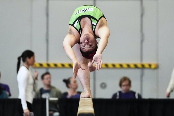 Raiden Hung of Jurassic Gymnastics from Boston, competes on the balance beam at the 2025 NAIGC national competition in Pittsburgh, Friday, April 4, 2025. (AP Photo/Gene J. Puskar)