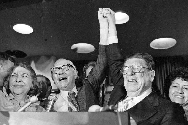 FILE - In this June 7, 1978 file photo, Paul Gann, left, and Howard Jarvis, right, celebrate as their co-authored tax initiative Proposition 13 takes a commanding lead and ultimately won in the California primary in Los Angeles. California Gov. Gavin Newsom announced Monday, May 10, 2021, he plans to send money back to most state taxpayers because the state is projected to exceed a voter-approved limit on appropriations for only the second time ever. The limit is named after Paul Gann, a conservative activist who died in 1989 who campaigned for the limit. (AP Photo/File)