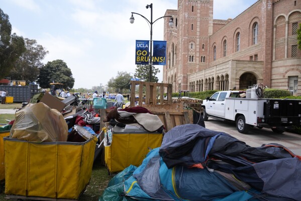Tents and trash are left behind at the site of a pro-Palestinian encampment which was cleared by police overnight on the UCLA campus, Thursday, May 2, 2024, in Los Angeles. (AP Photo/Ashley Landis)