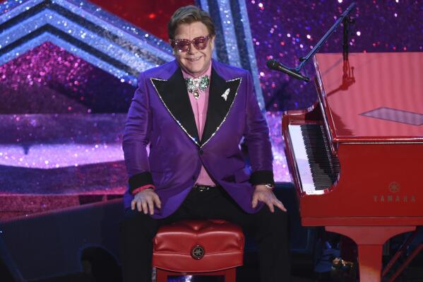 FILE - Elton John is seen after performing "(I'm Gonna) Love Me Again" nominated for the award for best original song from "Rocketman" at the Oscars on Feb. 9, 2020, at the Dolby Theatre in Los Angeles. John is releasing an album of collaborations with artists from several generations and genres, including Nicki Minaj, Young Thug, Miley Cyrus, Lil Nas X, Stevie Nicks and Stevie Wonder. “The Lockdown Sessions,” a collection of 16 songs featuring John with artists from Dua Lipa to the late Glen Campbell, will be released on Oct. 22.  (AP Photo/Chris Pizzello, File)