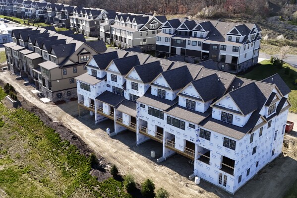 FILE - Townhouses under construction are shown in Cranberry Township, Pa., on March 29, 2024. On Thursday, May 16, 2024, Freddie Mac reports on this week's average U.S. mortgage rates. (AP Photo/Gene J. Puskar, File)