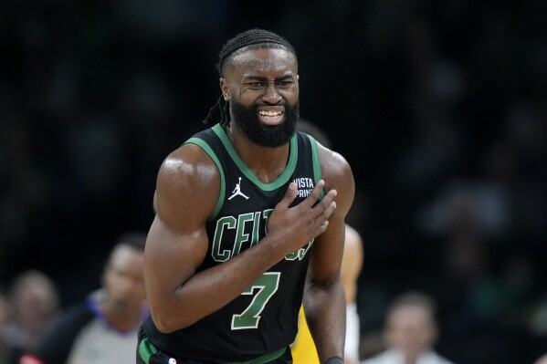 Boston Celtics guard Jaylen Brown (7) reacts on the court during the first half of Game 2 of the NBA Eastern Conference basketball finals against the Indiana Pacers, Thursday, May 23, 2024, in Boston. (AP Photo/Steven Senne)