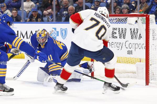 Florida Panthers right wing Patric Hornqvist (70) puts the puck past Buffalo Sabres goaltender Craig Anderson (41) during the second period of an NHL hockey game, Monday, March 7, 2022, in Buffalo, N.Y. (AP Photo/Jeffrey T. Barnes)