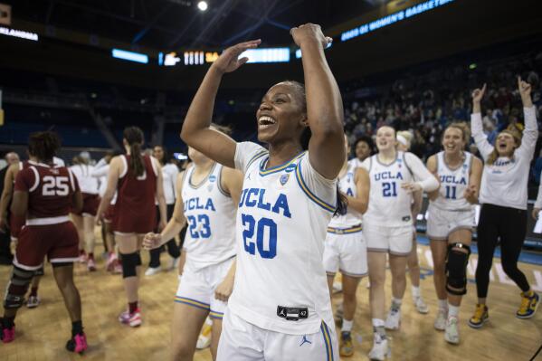 UCLA guard Charisma Osborne (20) reacts towards the stands after defeating Oklahoma in a second-round college basketball game in the NCAA Tournament, Monday, March 20, 2023, in Los Angeles. UCLA won, 82-73. (AP Photo/Kyusung Gong)